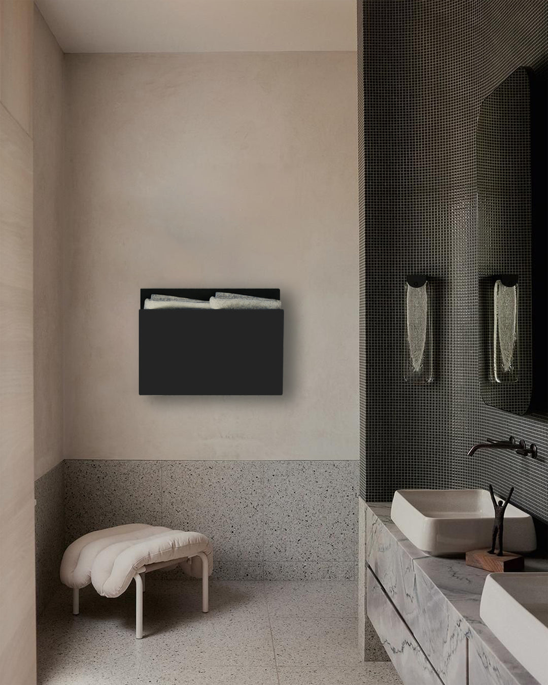 MG12 Geometrici Magazine towel warmer in black in a tiled bathroom