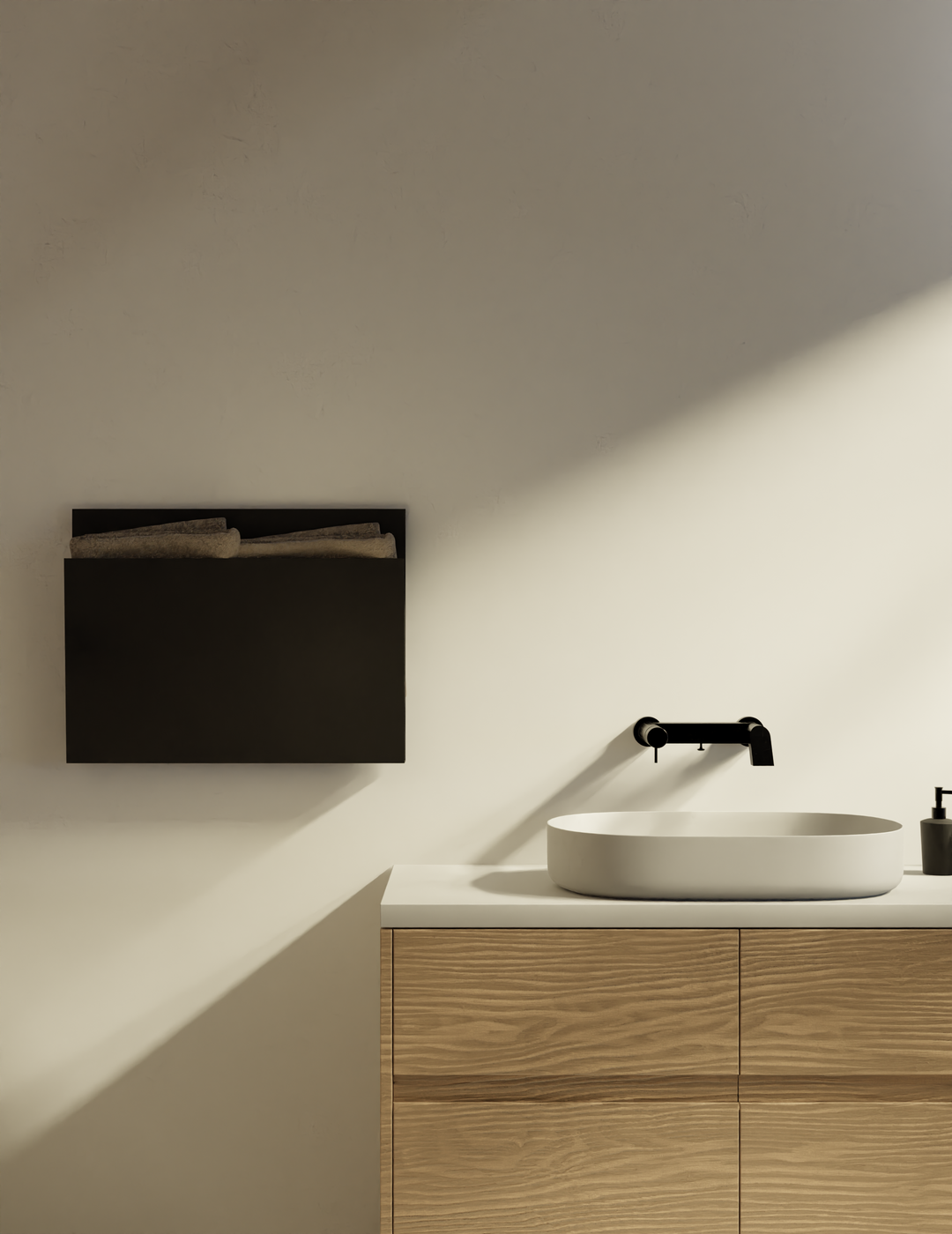 MG12 Geometrici Magazine towel warmer in black above a wood vanity with a vessel sink