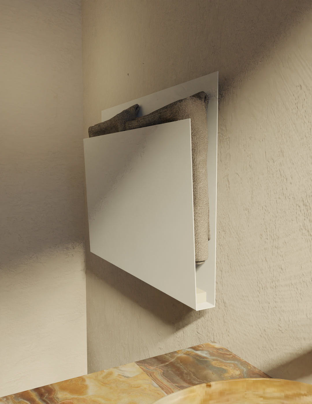 MG12 Geometrici Magazine towel warmer in white with folded towels - angled view