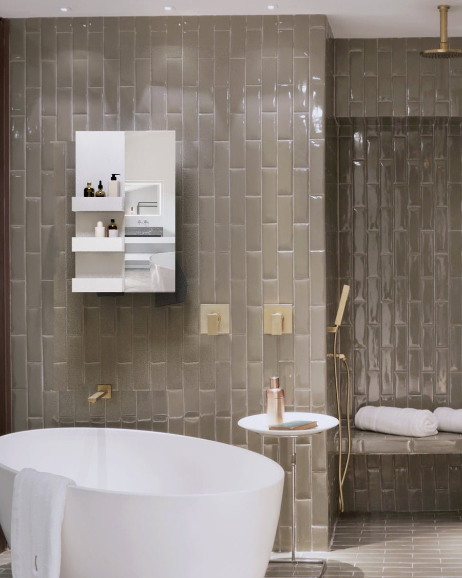 MG12 Geometrici Rectangle and Shelf towel warmer with mirror in a tiled bathroom with a freestanding tub