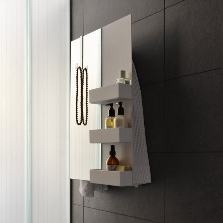MG12 Geometrici Rectangle and Shelf towel warmer with mirror and heated shelves - close-up with toiletries