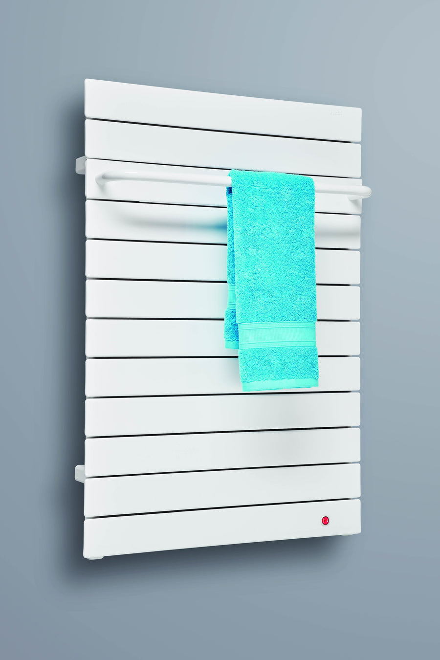 Runtal Omnipanel II electric towel warmer in white with a blue towel on the towel bar